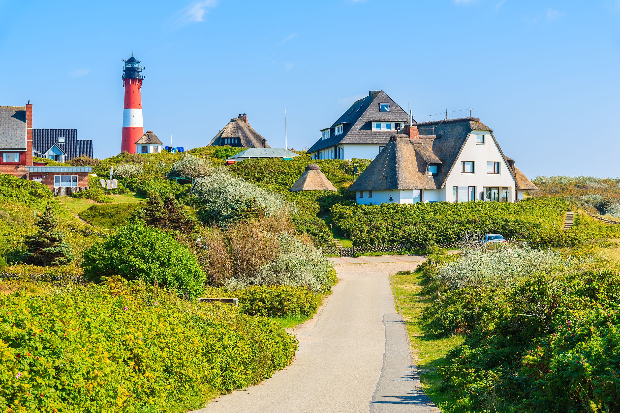 Road to lighthouse in Hornum village on southern coast of Sylt island,