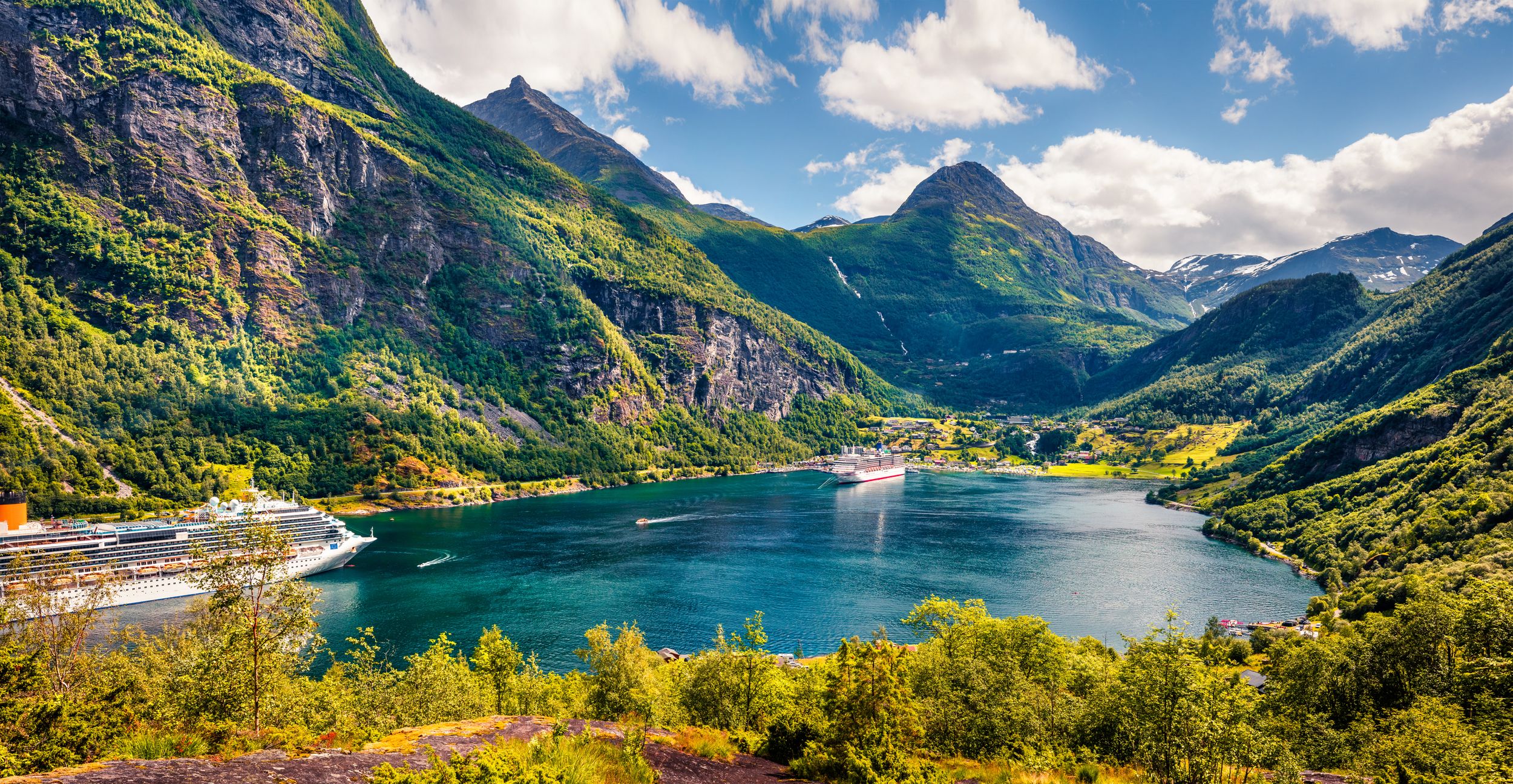 Picturesque summer scene of Geiranger port, western Norway. Colorful v