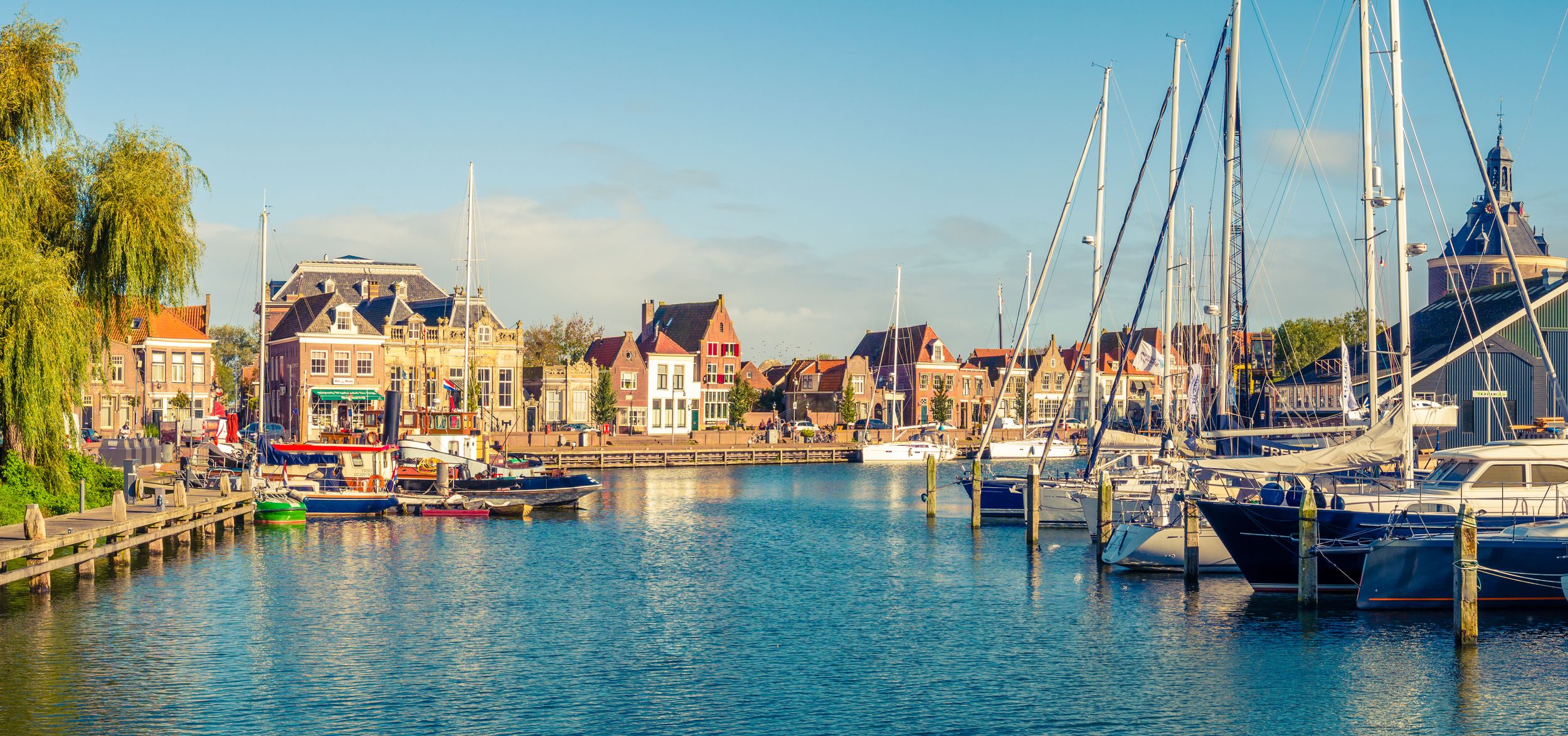 Panorama of old harbour with boats and quayside in historic city of En