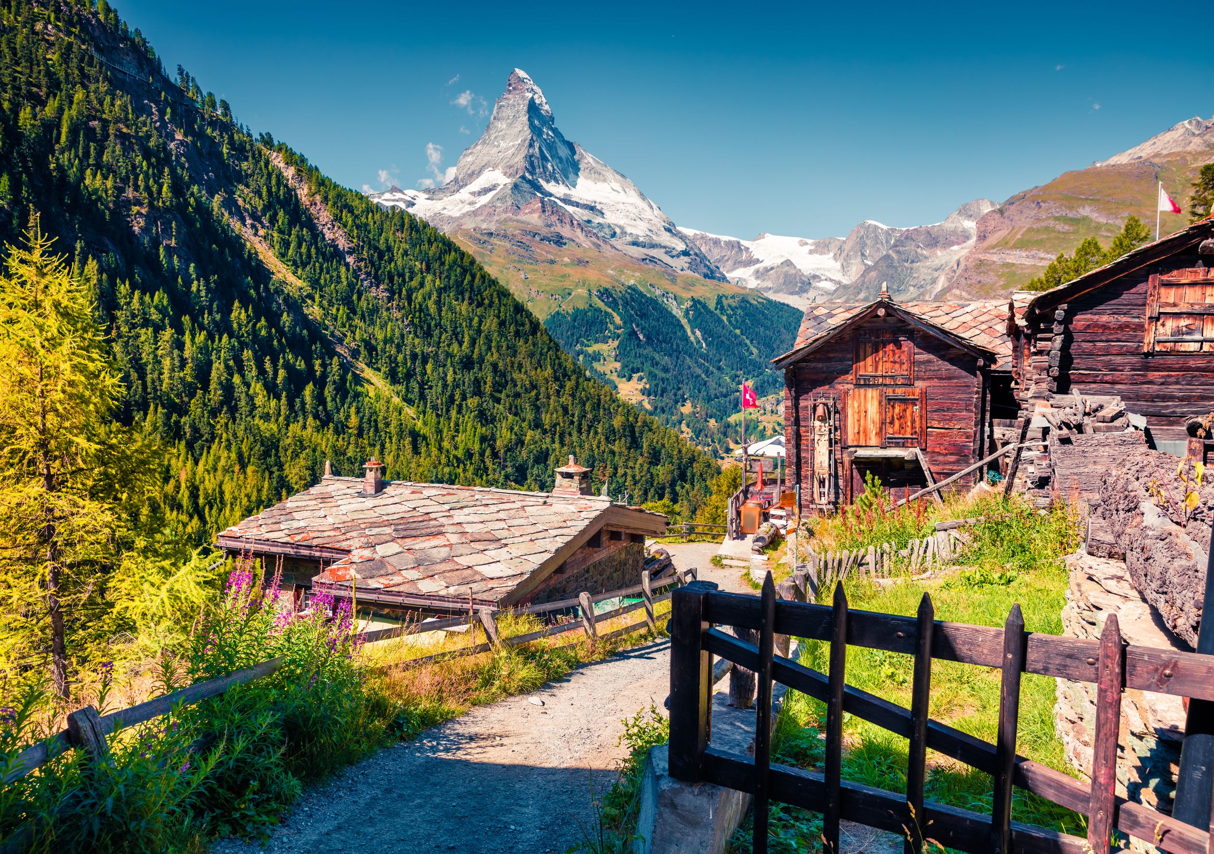 Sunny summer morning in Zermatt village with Matterhorn (Monte Cervino