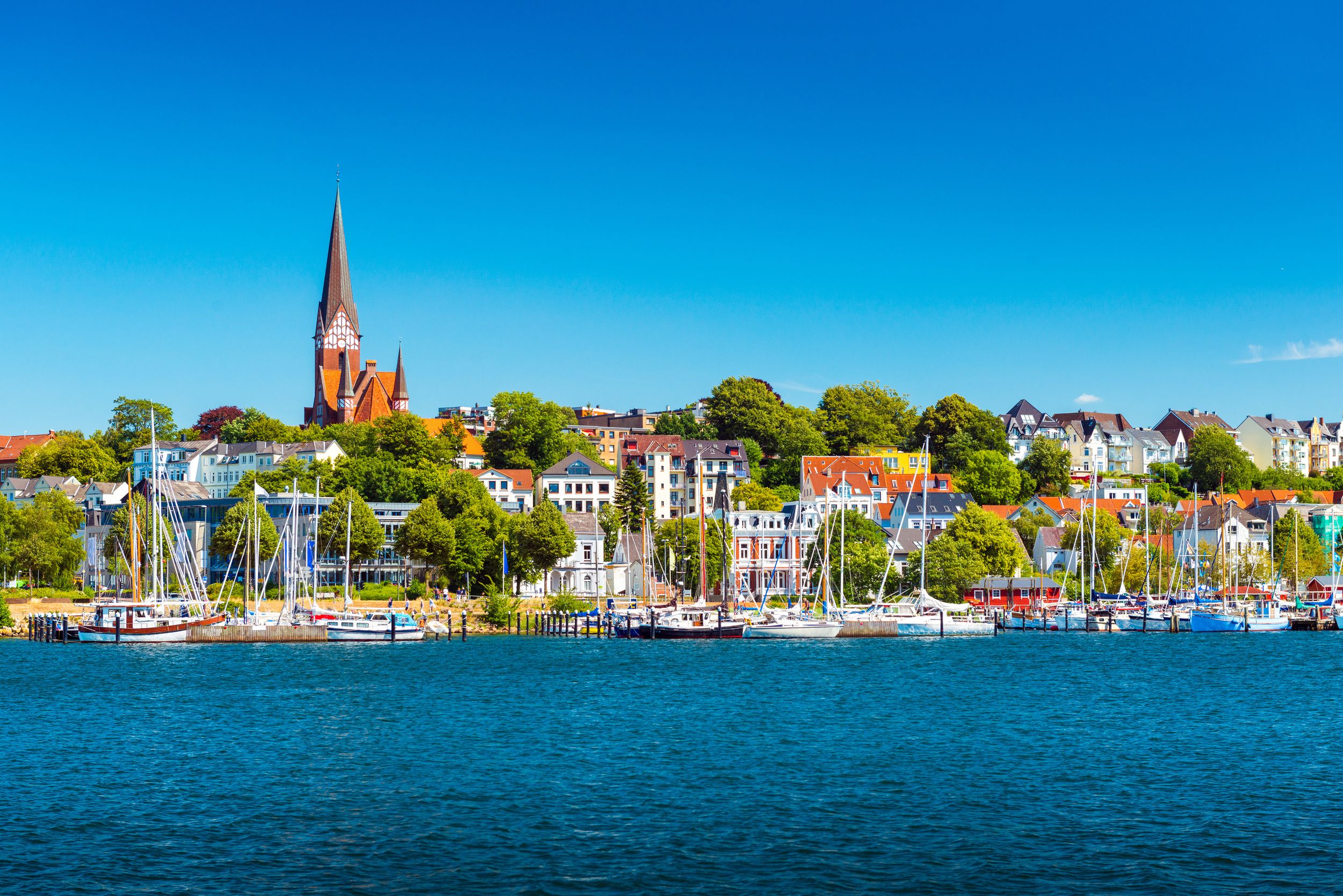 Flensburg cityscape at summer day. Skyline of the old european town. P