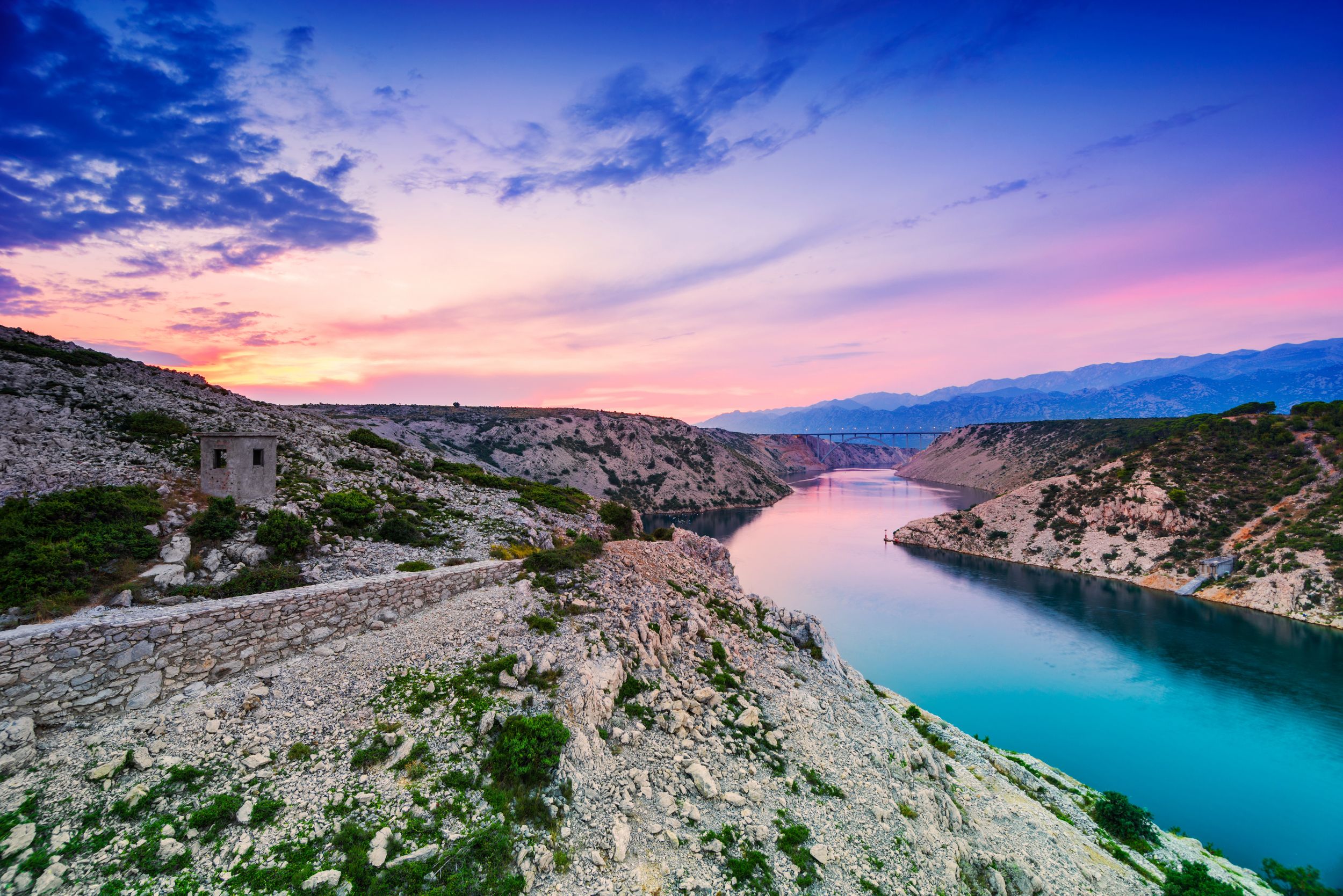 Colorful evening scenic view from Maslenica bridge over the river and 