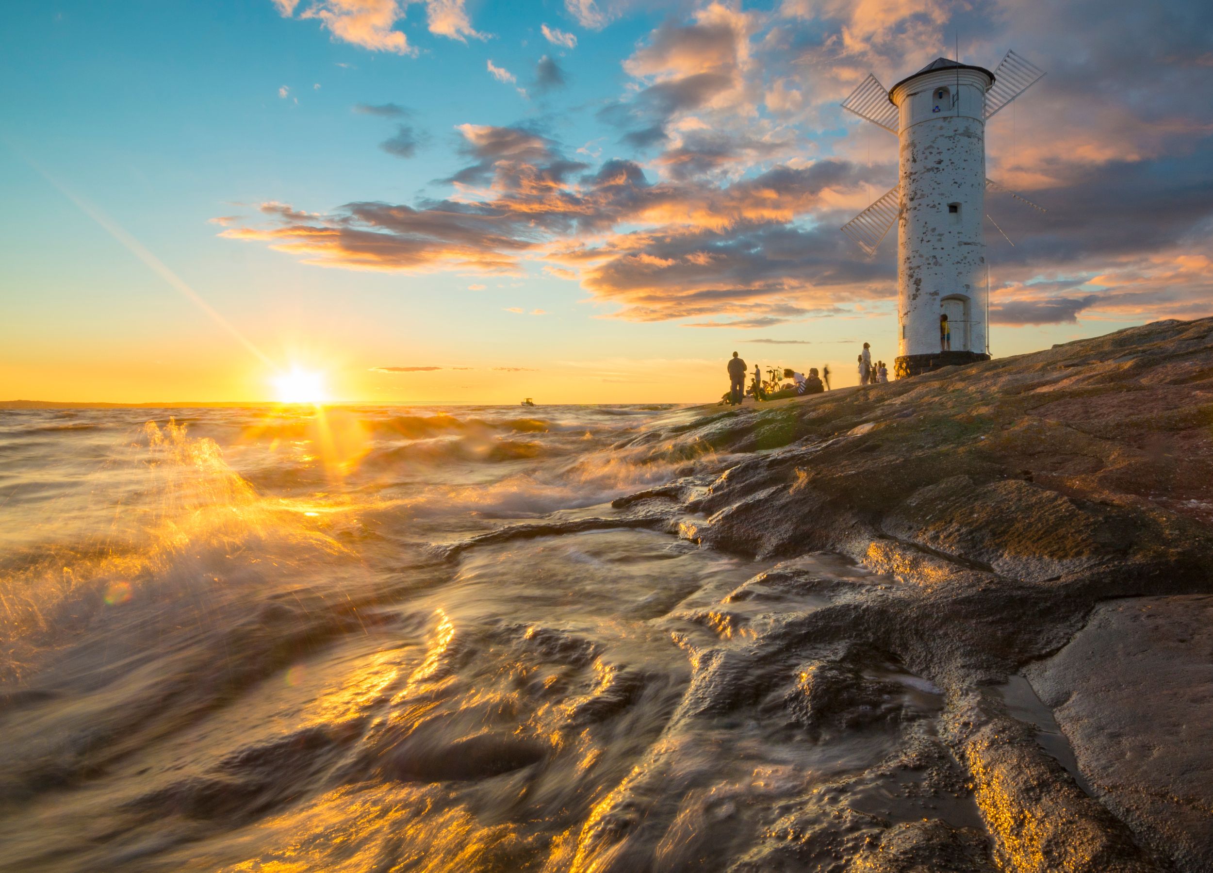 lighthouse in the form of a windmill at sunset, Swinoujscie, Poland