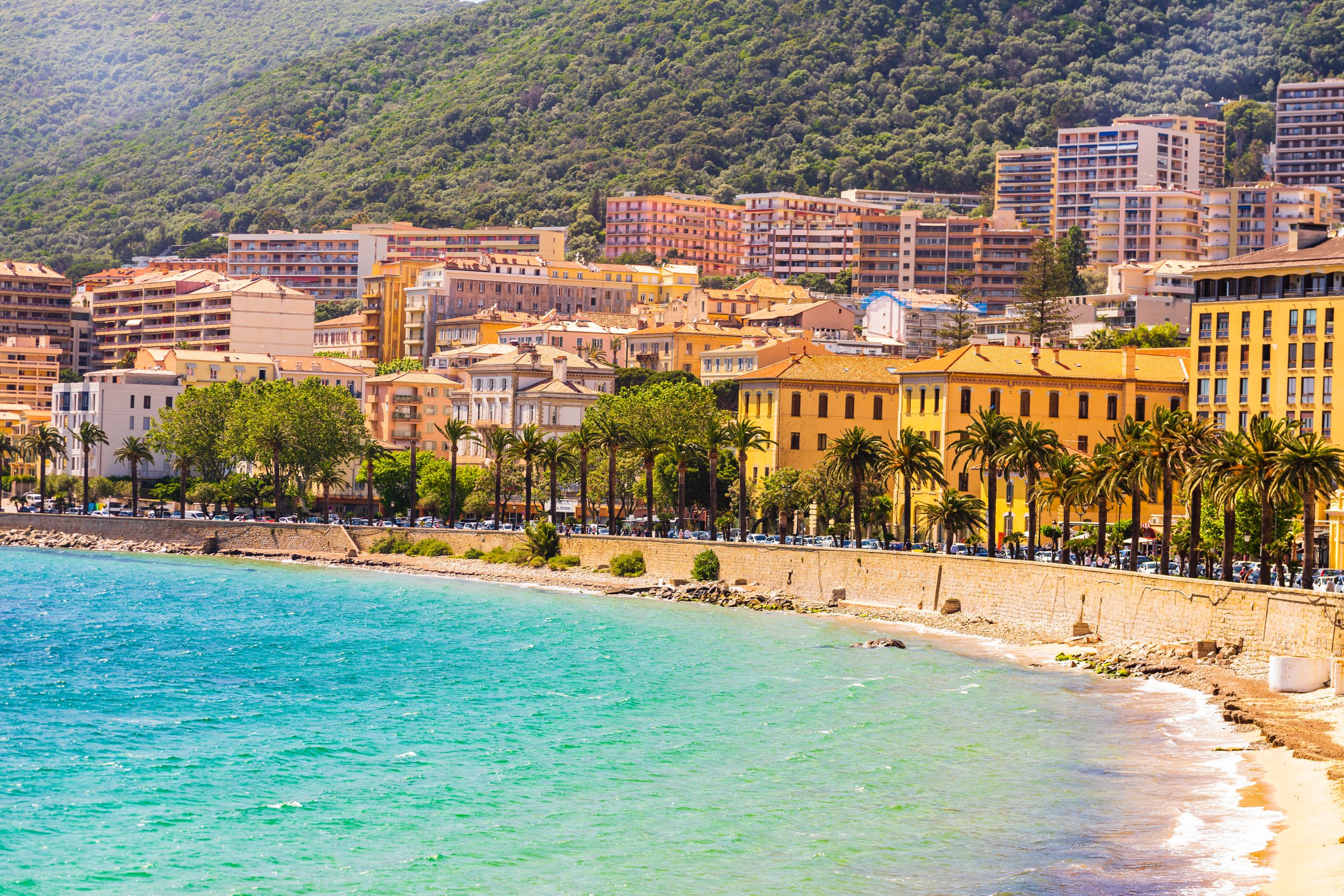 Ajaccio public beach with tourists at sunny day. Summer landscape of C