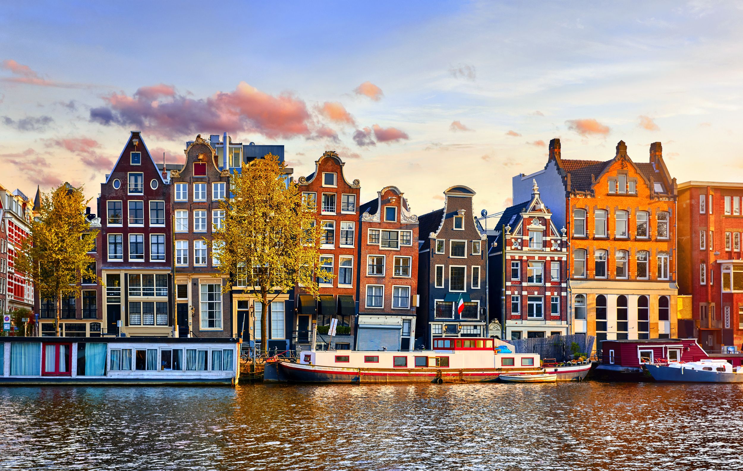 Amsterdam Netherlands dancing houses over river Amstel landmark in old