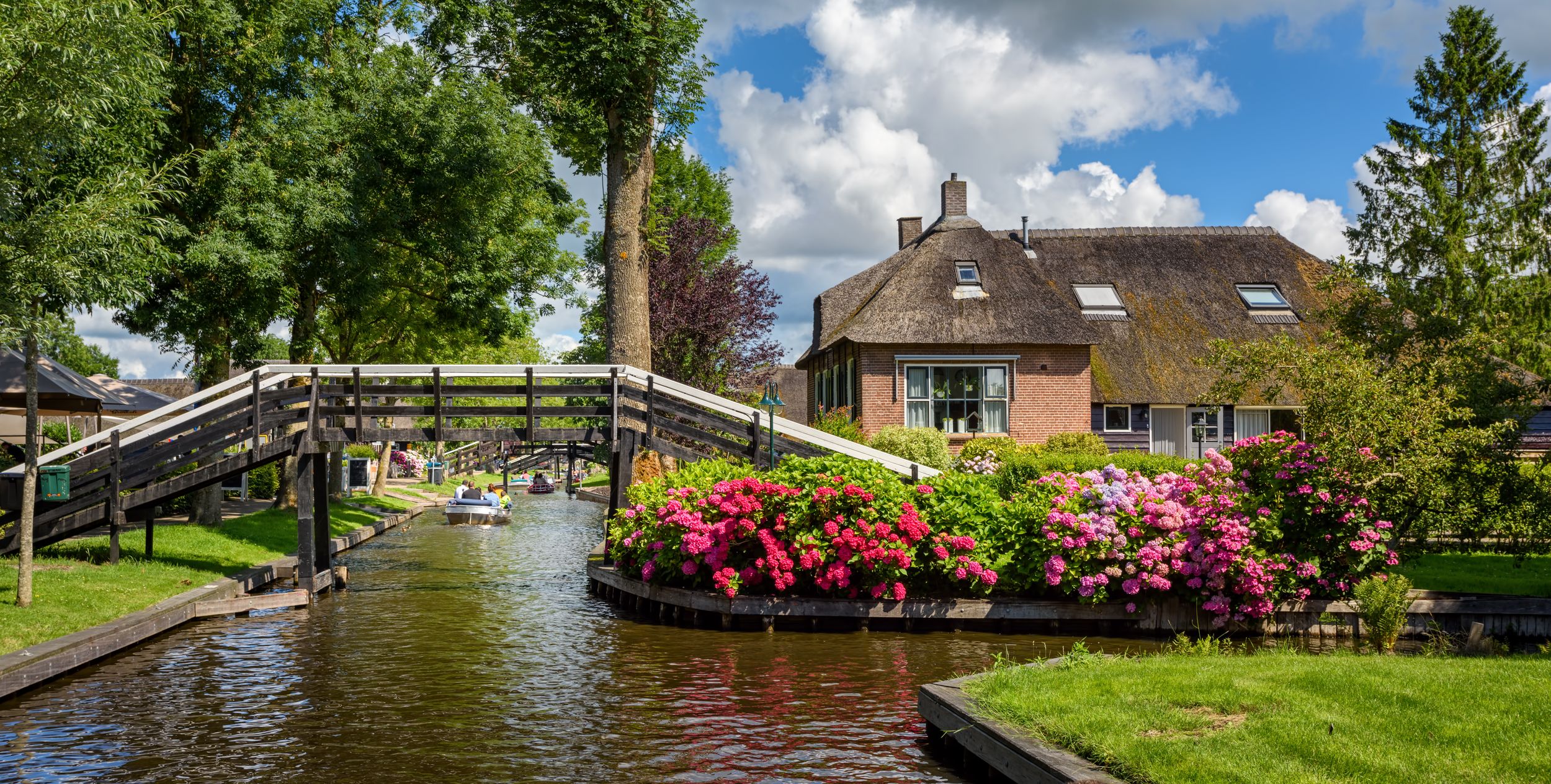 Panoramiv view of the water canal and traditional dutch brick houses i