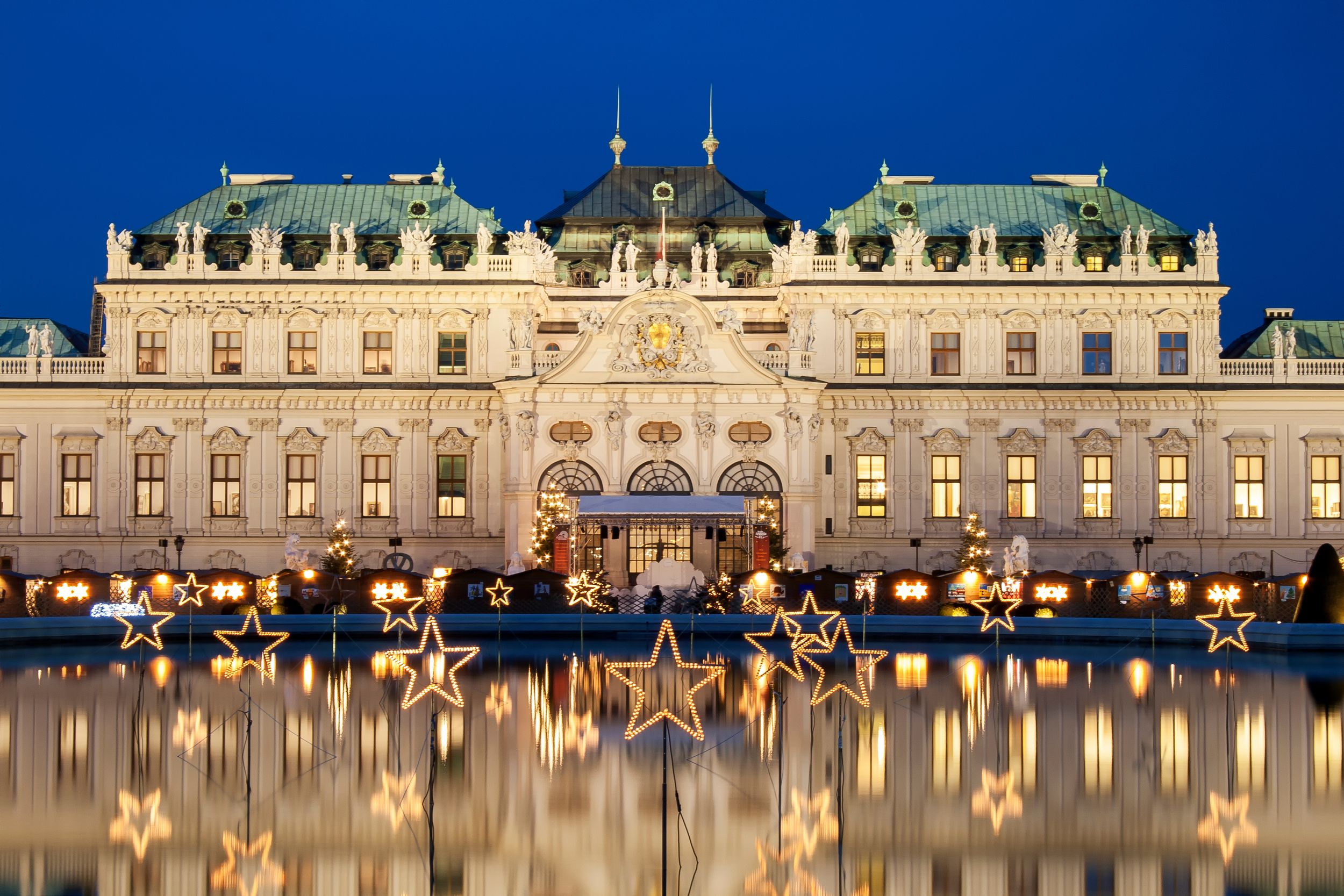 Christmas stars reflected in a pool in the centre of Vienna, Austia