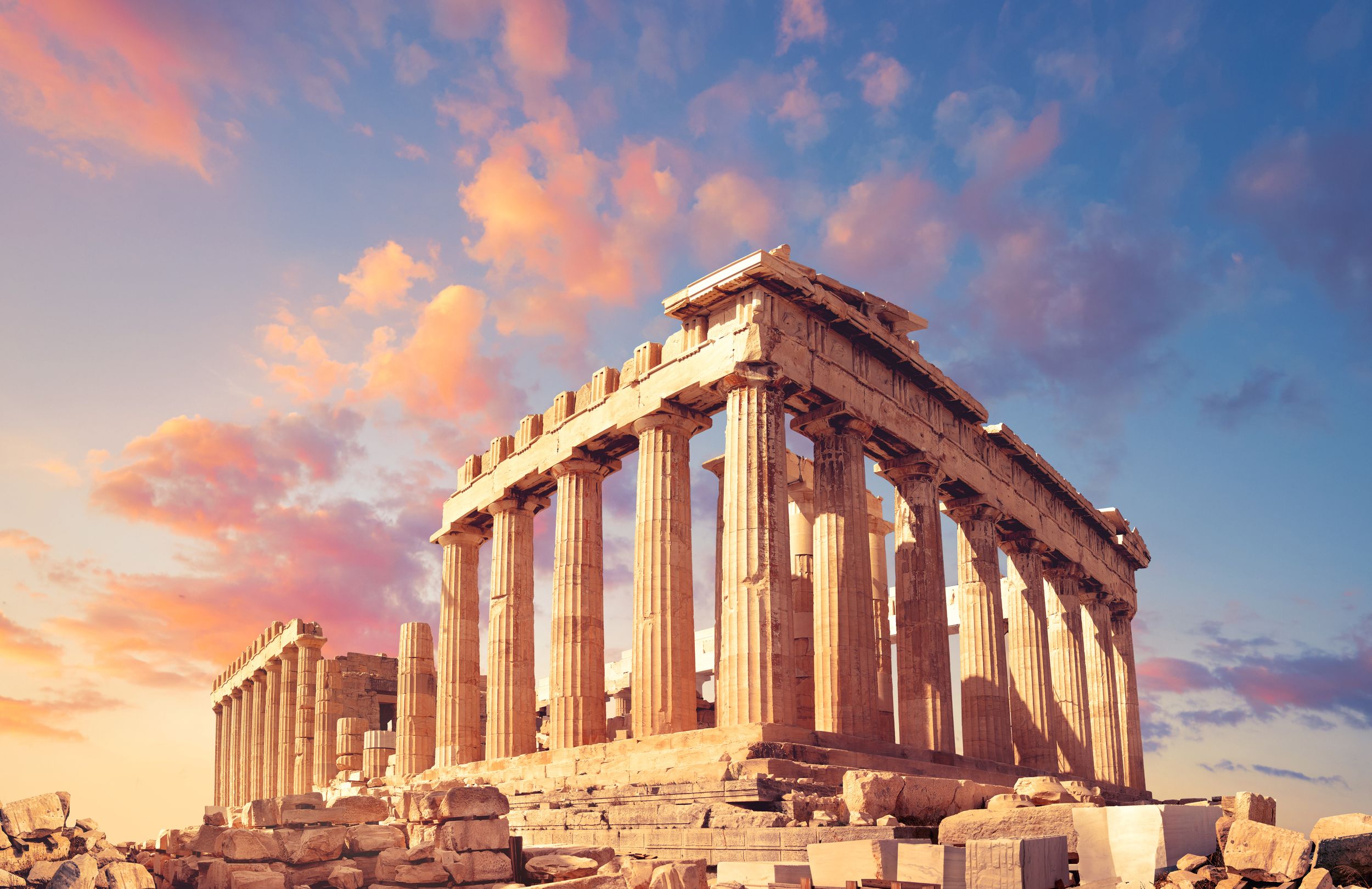Parthenon temple on a sunset with pink and purple clouds. Acropolis in