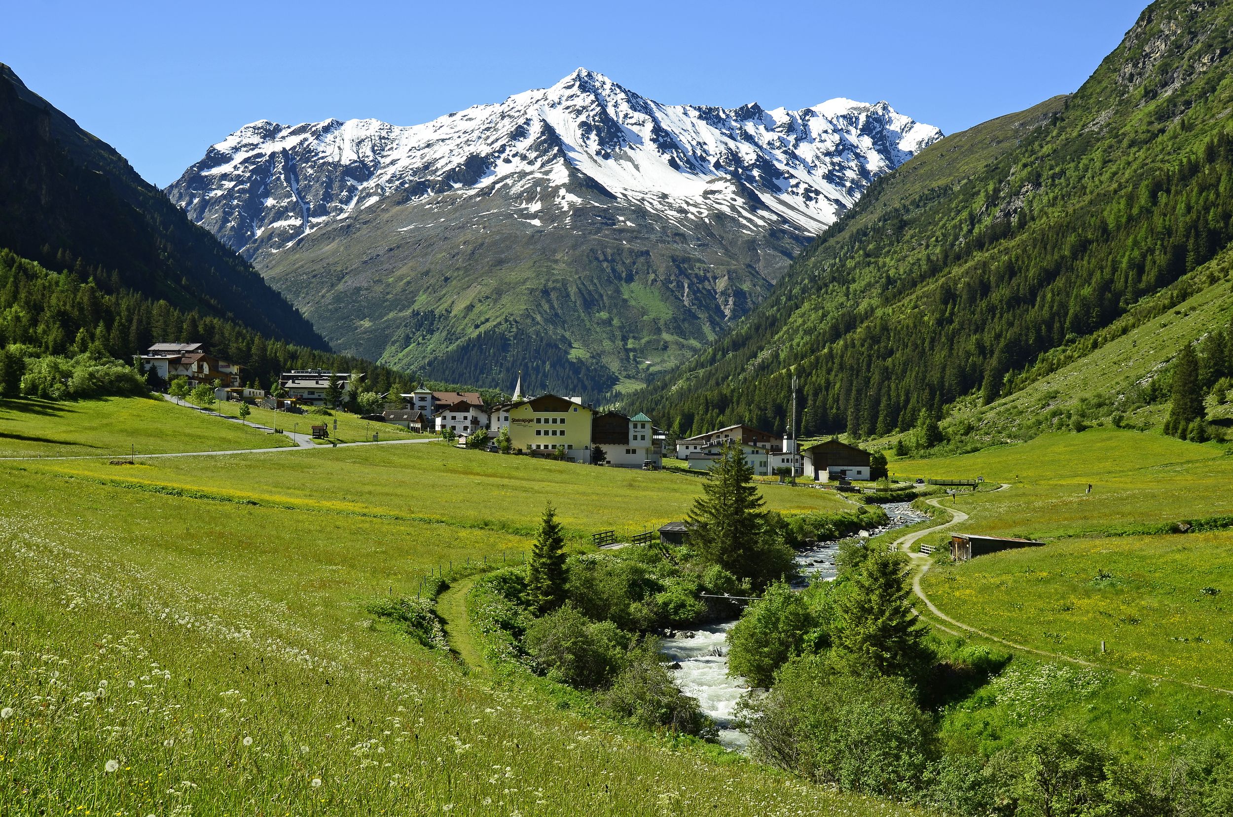 Plangeross, Austria - June 23rd 2016: Tiny village in Pitztal with sno