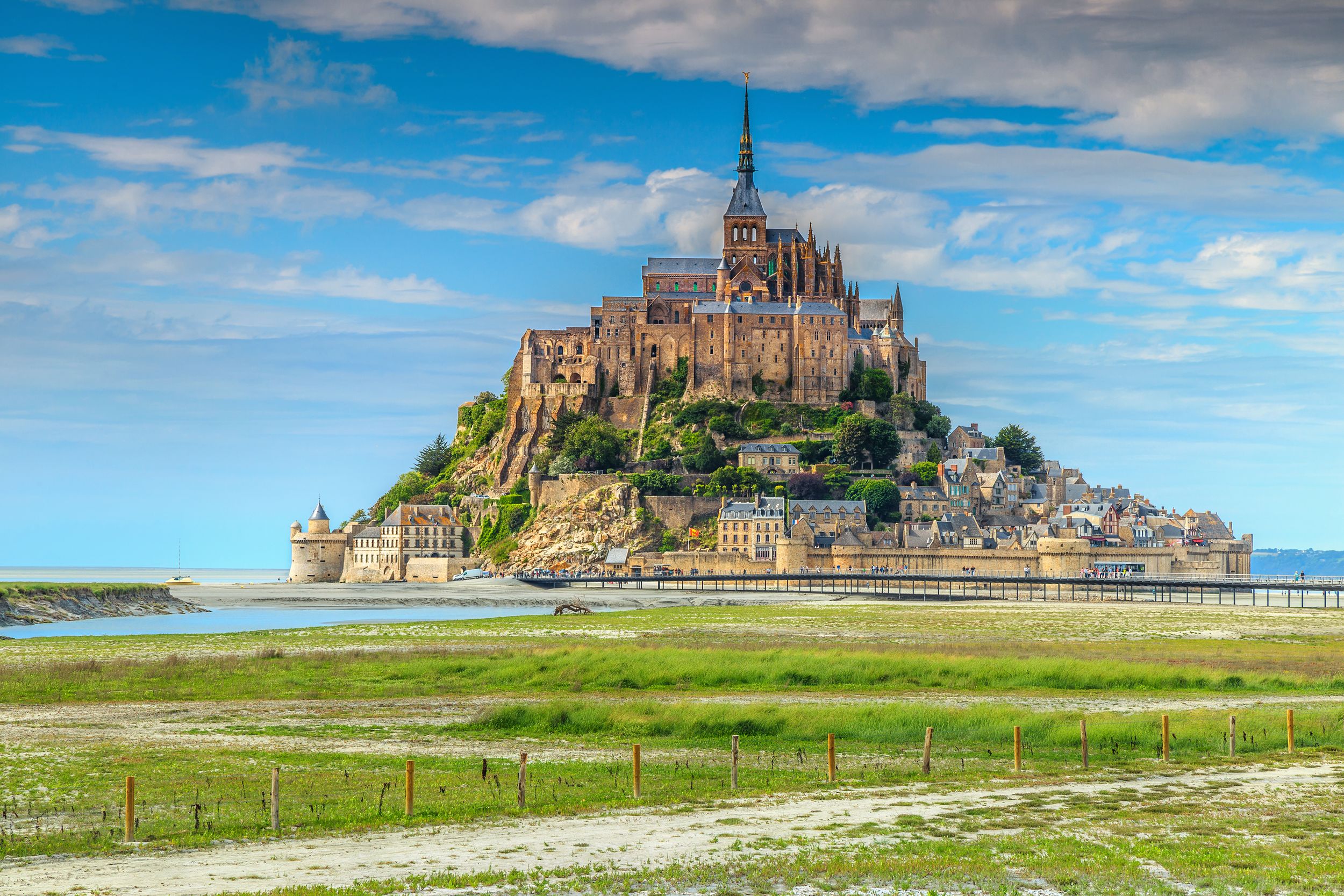 Stunning Mont Saint Michel cathedral on the island with modern bridge,
