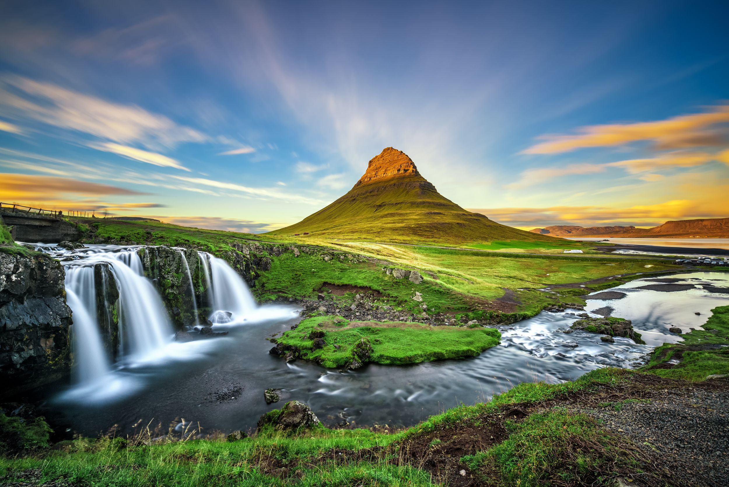 Summer sunset over the famous Kirkjufellsfoss Waterfall with Kirkjufel