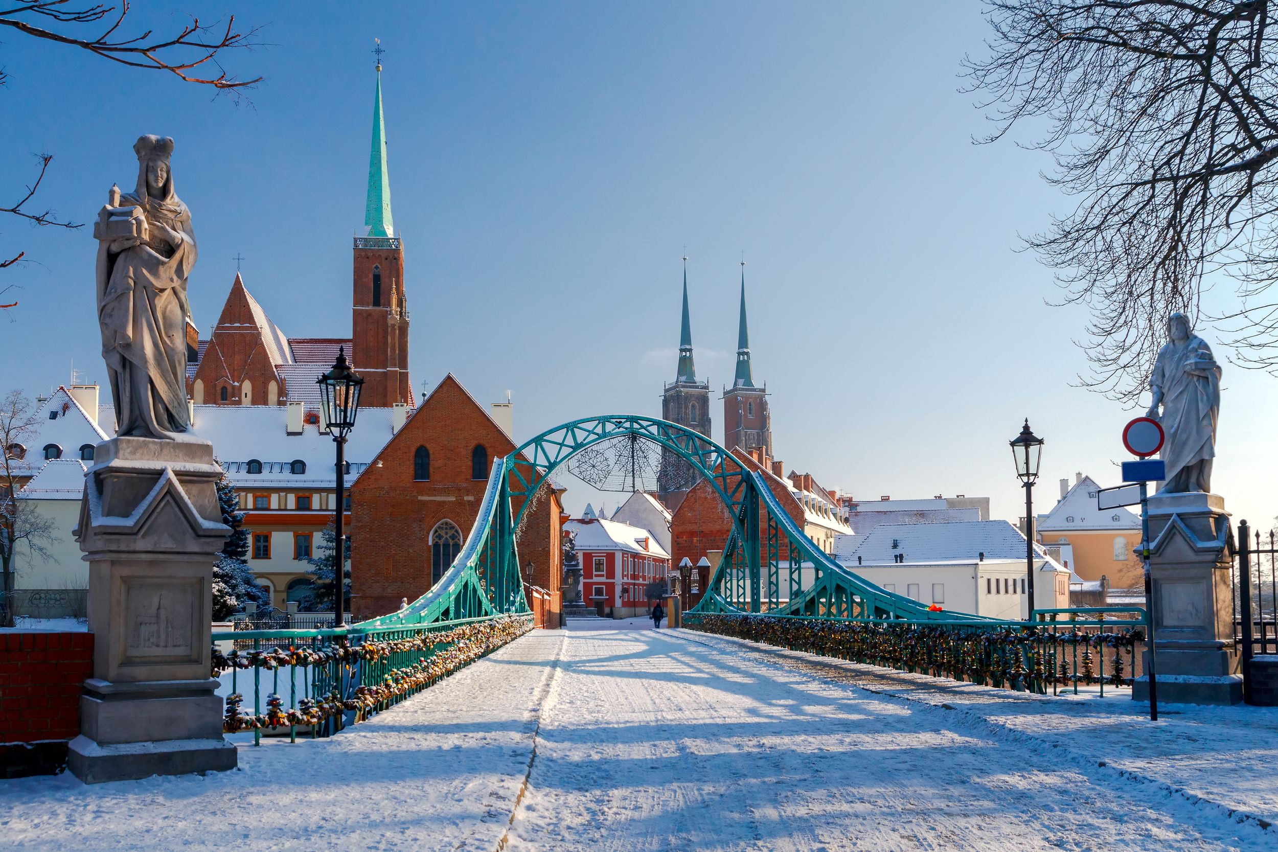 Tumski bridge over the river Odra to the island in winter.