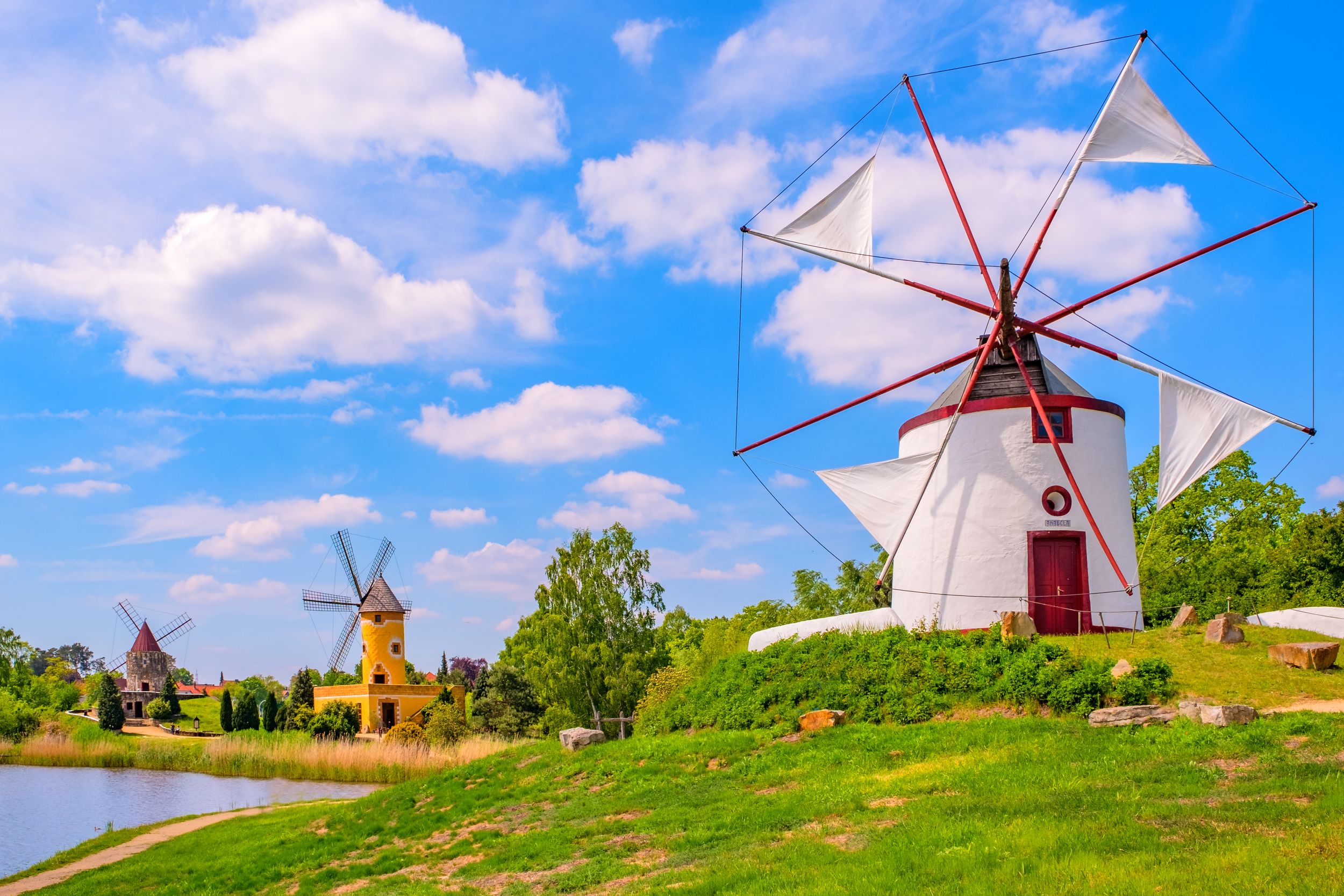 Colorful windmill in Gifhorn of the lake in summer