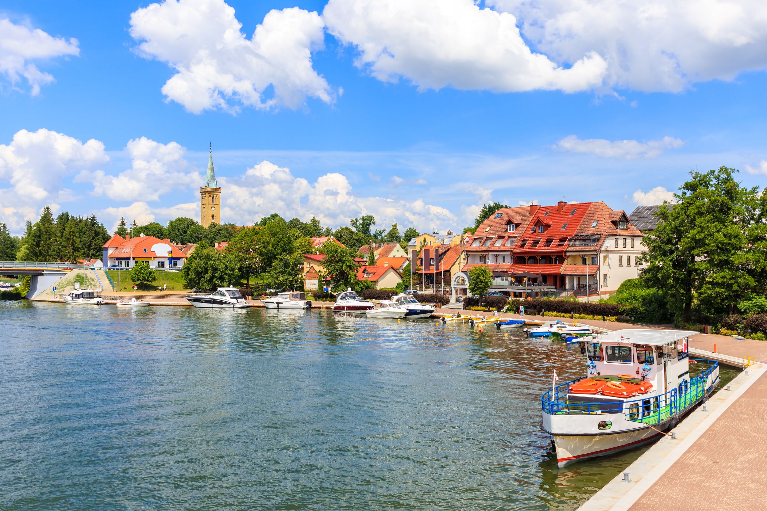 Tourist ship in Mikolajki port on sunny summer day, Mazury Lake Distri