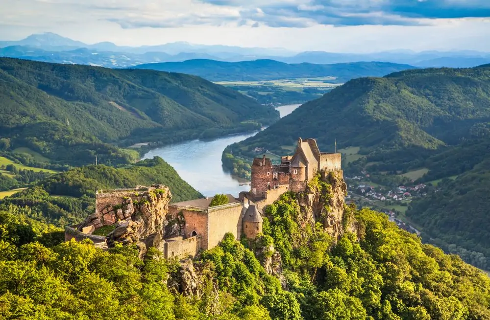 Beautiful landscape with Aggstein castle ruin and Danube river at suns