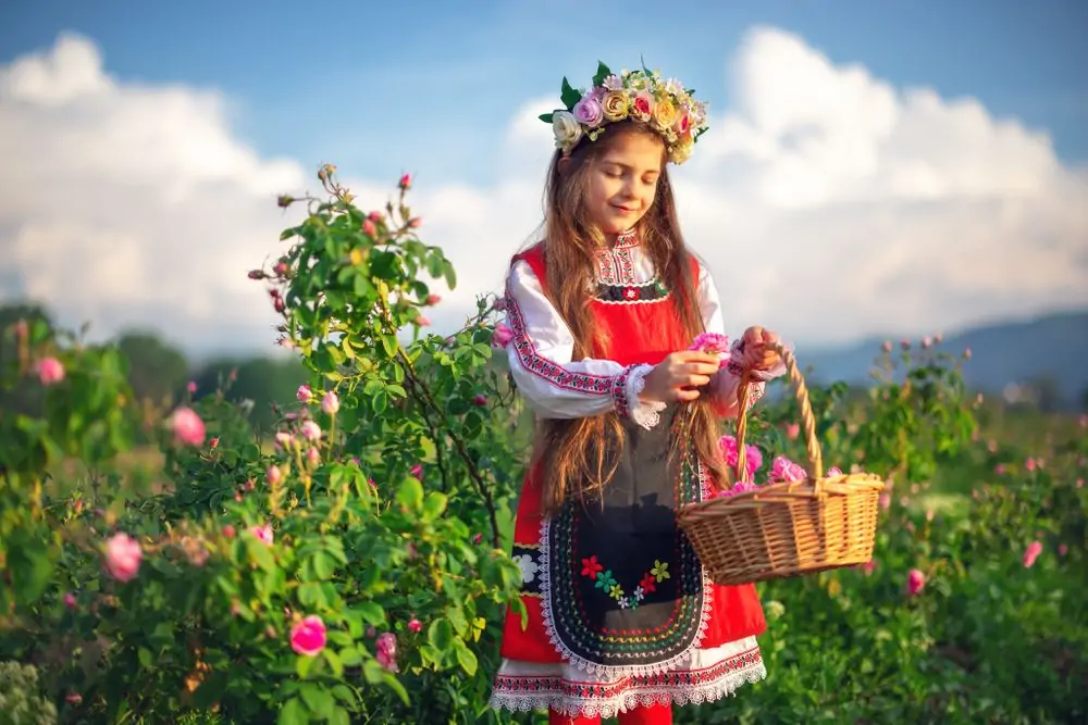 Beautiful girl, young bulgarian woman in ethnic folklore dress enjoyin