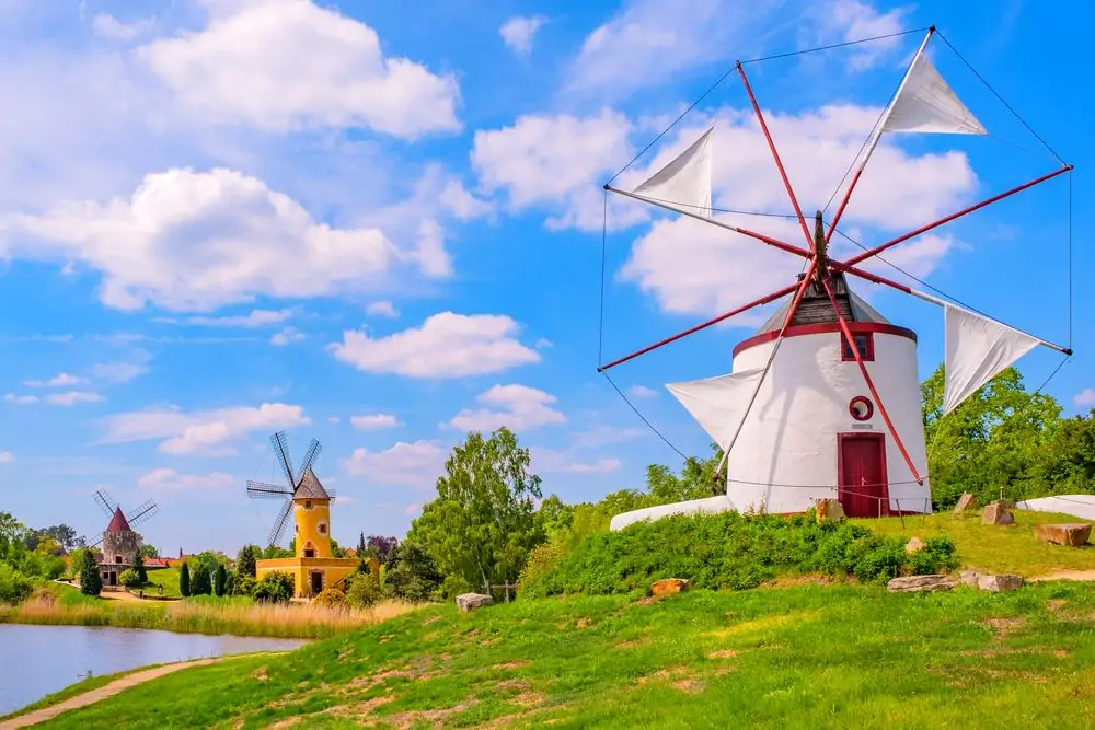 Colorful windmill in Gifhorn of the lake in summer